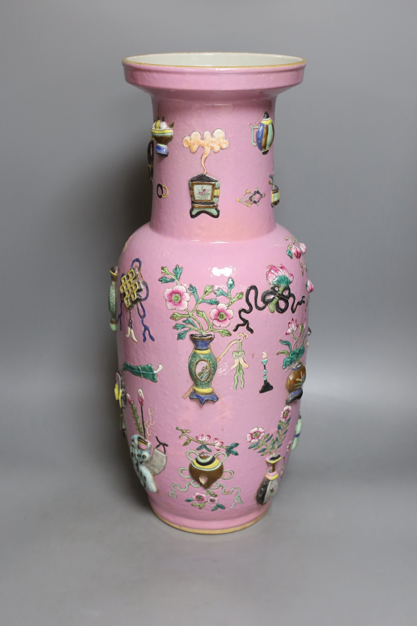 A large Chinese pink ground ‘Hundred Antiques’ vase, 49 cms high.